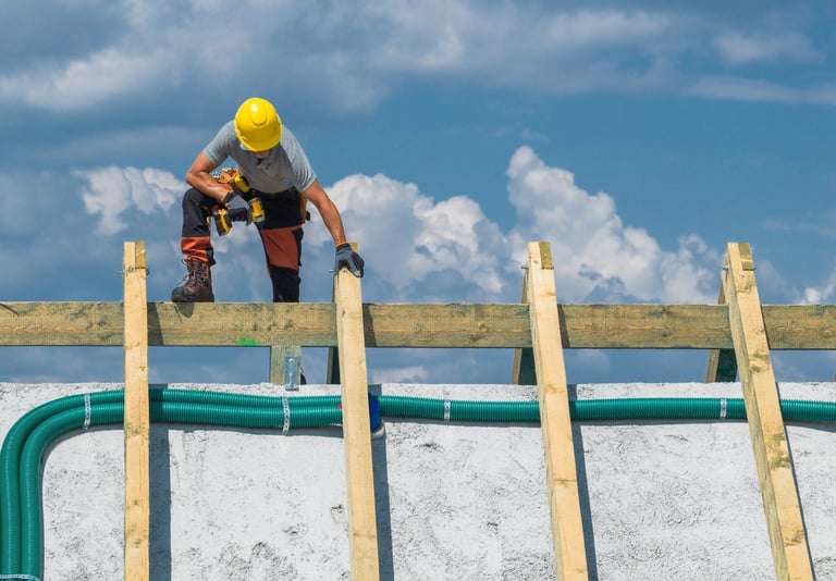 Contractor working on roof with scaffolding